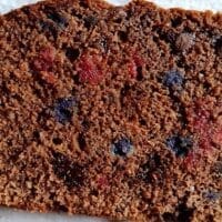 Slice of Martha White Chocolate Berry Quick Bread with bits of strawberry, blueberry, and melted chocolate chips