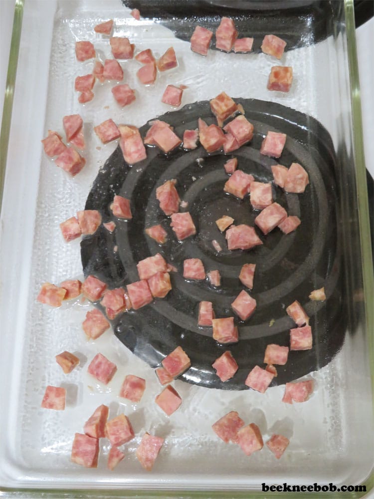 diced ham pieces in a breakfast casserole dish