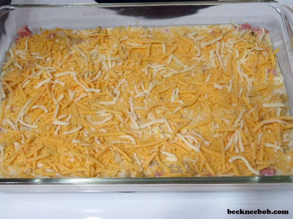 make ahead breakfast casserole for two with cheese, ham, egg, and potatoes