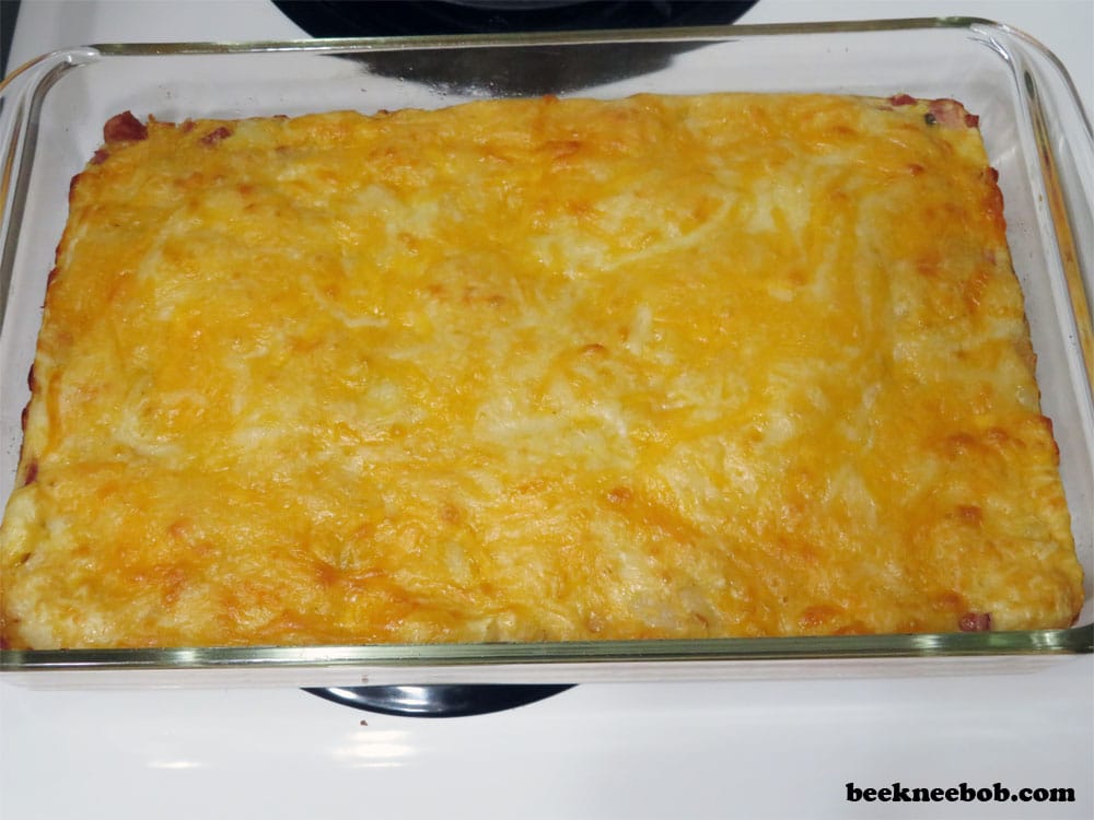 breakfast casserole for two with cheese, egg, ham, and potato