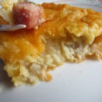 slice of ham, potato, egg, and cheese breakfast casserole for two