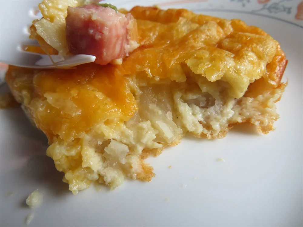 slice of ham, potato, egg, and cheese breakfast casserole for two
