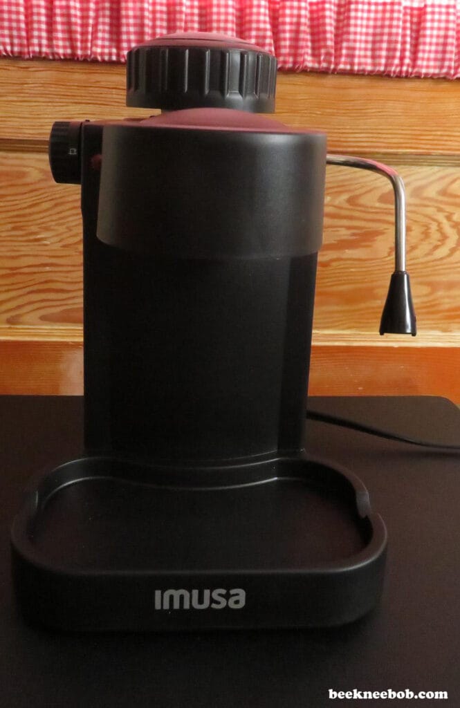 Base of the IMUSA 4-Cup Espresso & Cappuccino Maker showing controls and drip tray