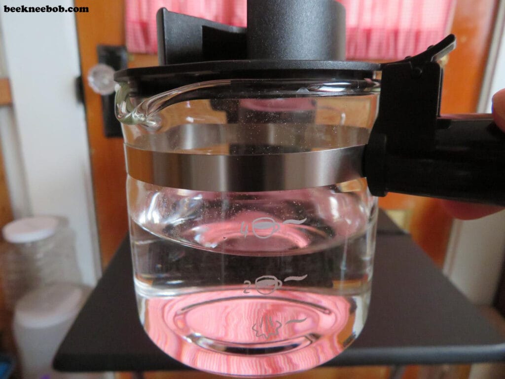 Close-up of IMUSA espresso carafe filled with water, ready for brewing