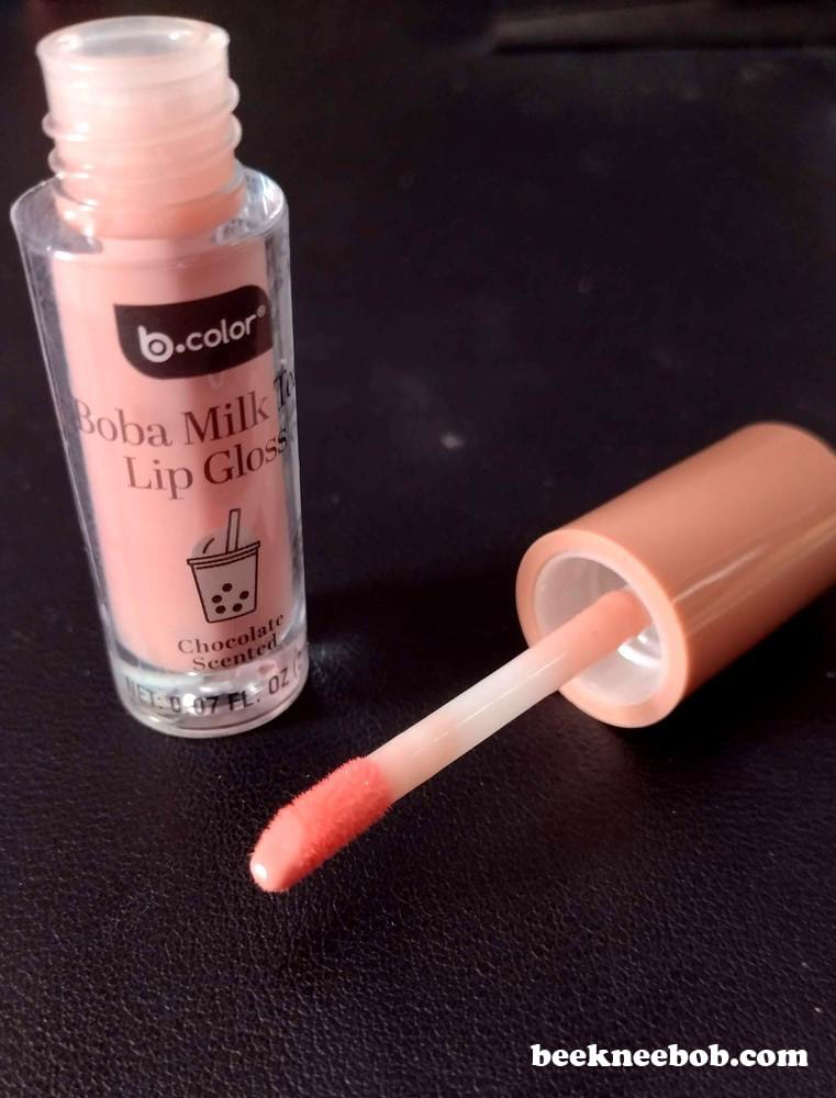 B Color Boba Milk Tea Lip Gloss with the cap off, showing the applicator with a light pink gloss.