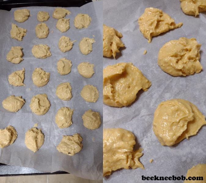 Scoops of honey cornbread cookie dough on baking sheet with parchment paper