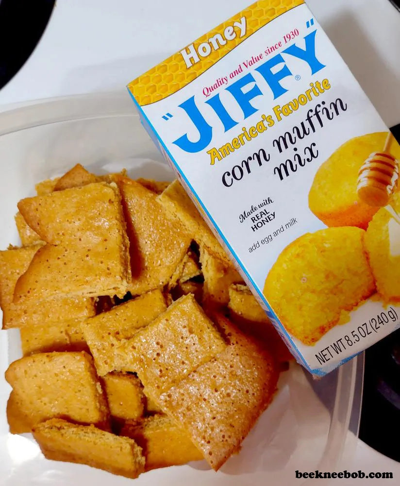 Container of honey cornbread cookies next to box of Jiffy Honey Corn Muffin Mix