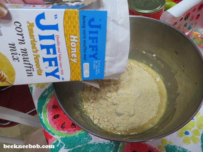 Box of Jiffy Honey Corn Muffin Mix poured into mixing bowl