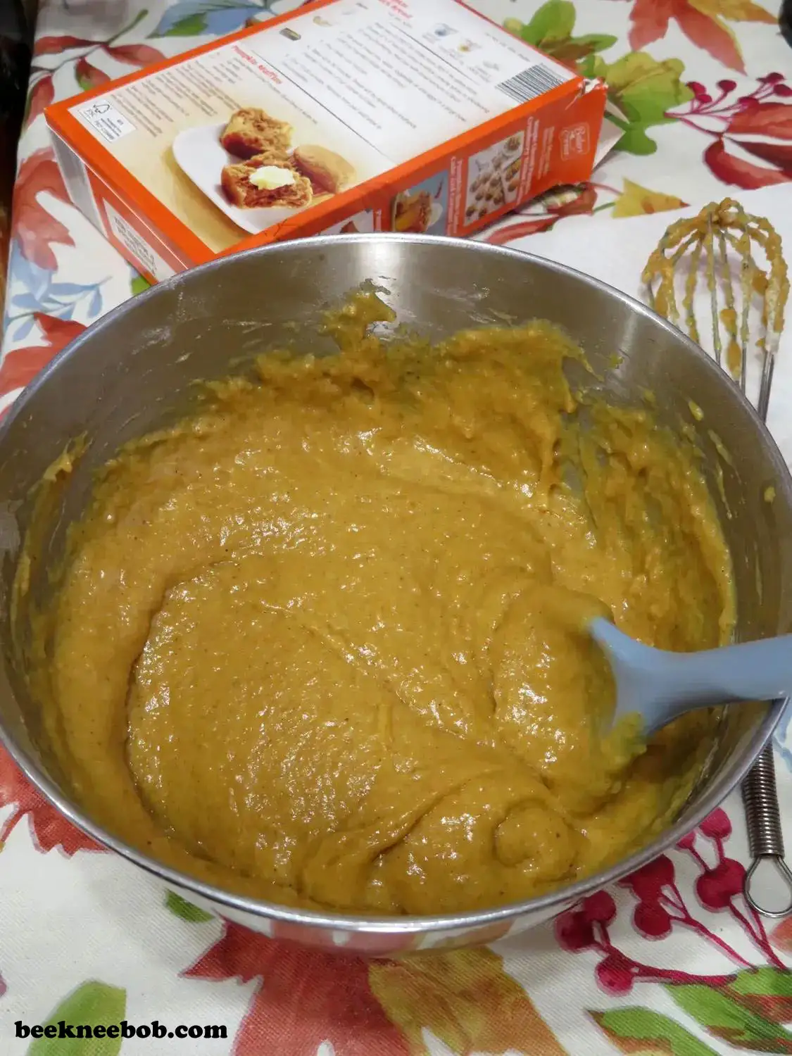 bowl containing prepared mixture for pumpkin quick bread