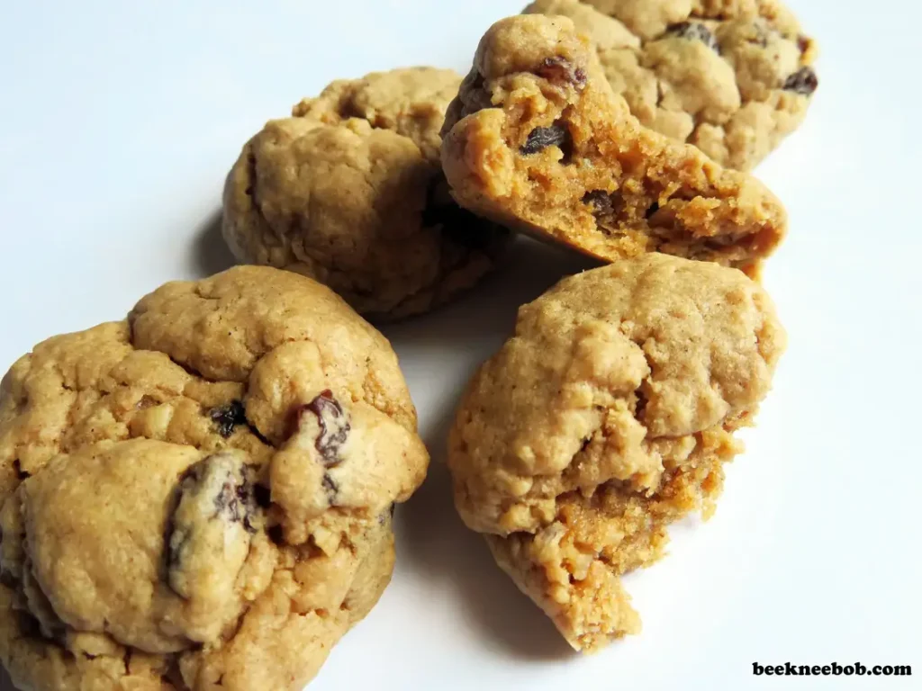 group of oatmeal raisin cookies with one split in half