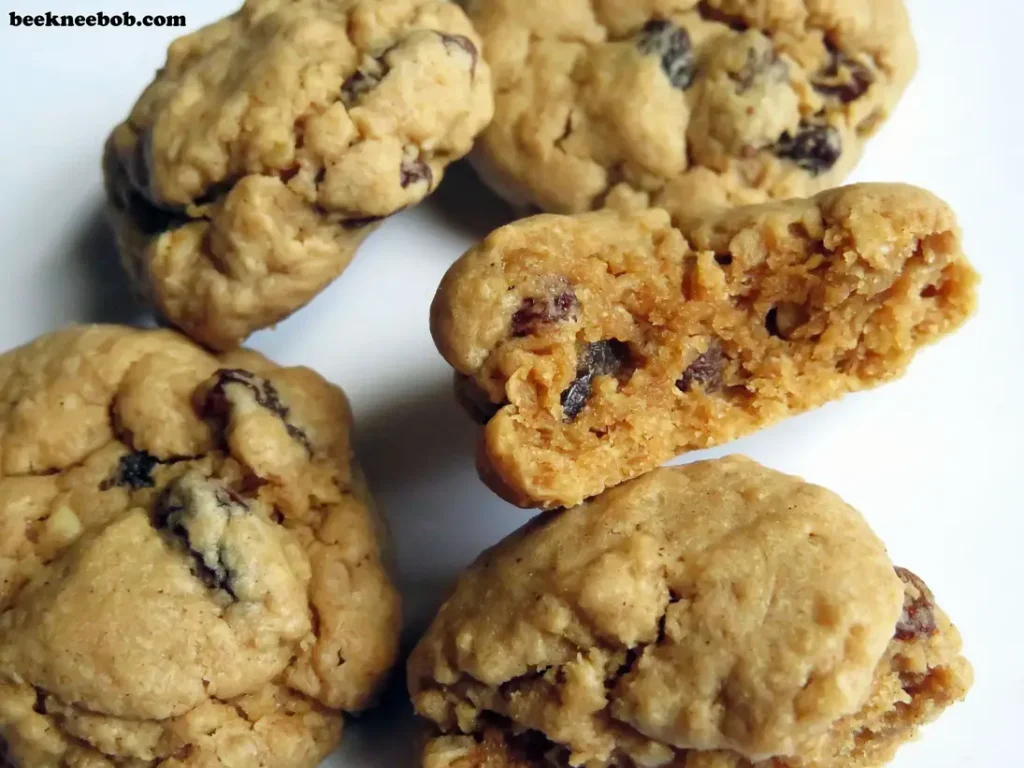 group of oatmeal raisin cookies with a bite taken out of one