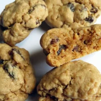 group of oatmeal raisin cookies with a bite taken out of one