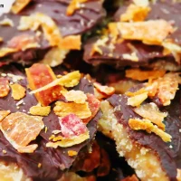 chocolate toffee saltine cracker bark topped with crumbled bacon