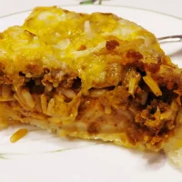 slice of deep dish taco casserole on plate