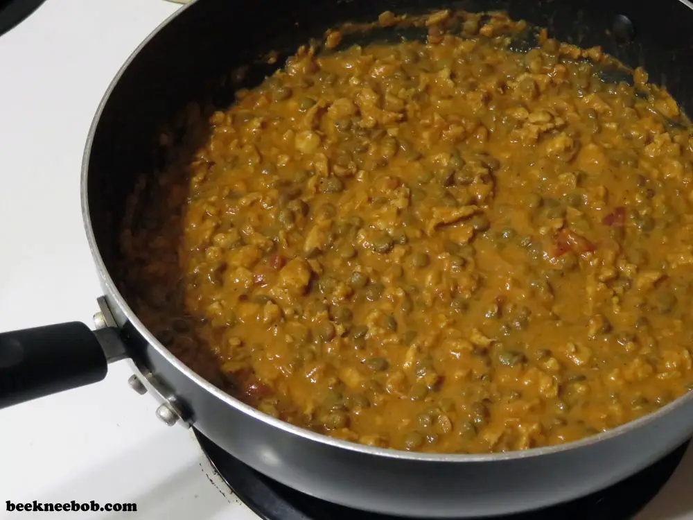 large skillet of chicken lentil curry