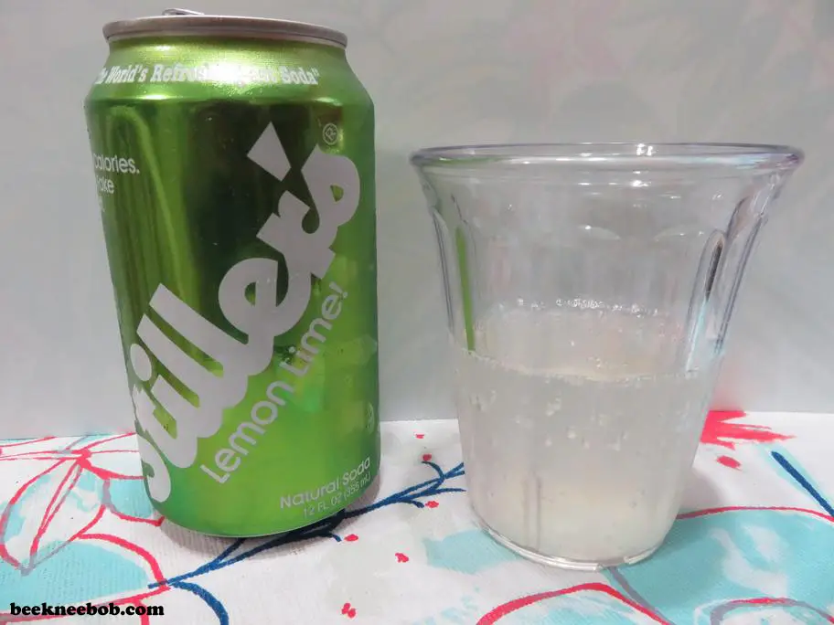 A cup containing Stiller's Lemon Lime Soda standing next to the soda can