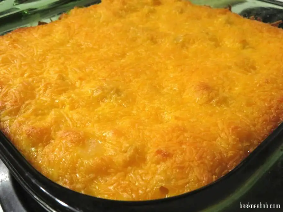 corner close up of 4-ingredient baked macaroni and cheese with a top layer of melted sharp cheddar cheese